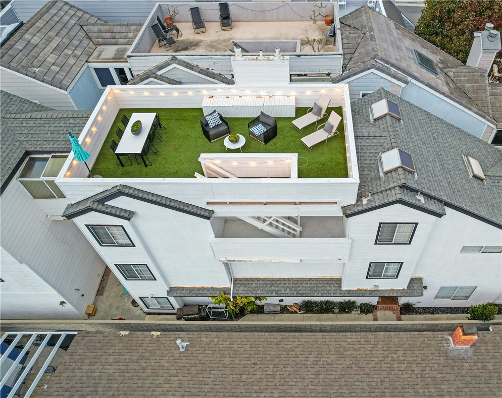 423 18th Street Huntington Beach, CA 92648 - Photo 55 of 67 a picture of a building with a yard