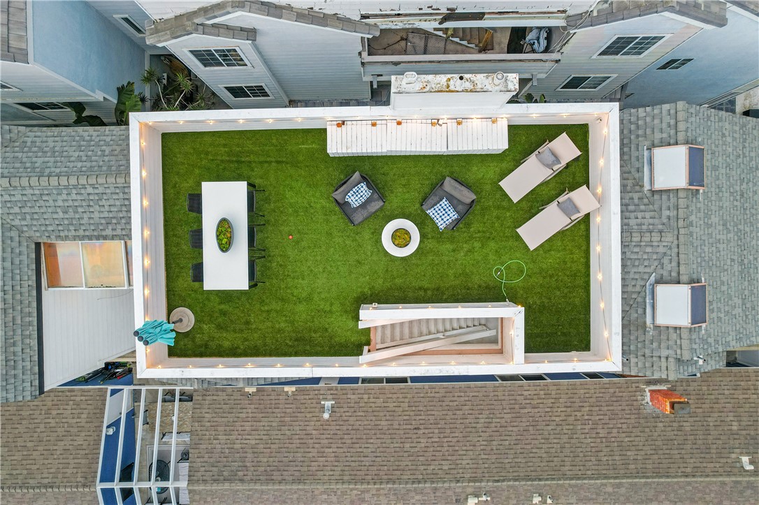 423 18th Street Huntington Beach, CA 92648 - Photo 56 of 67 an aerial view of a house with a yard table and chairs