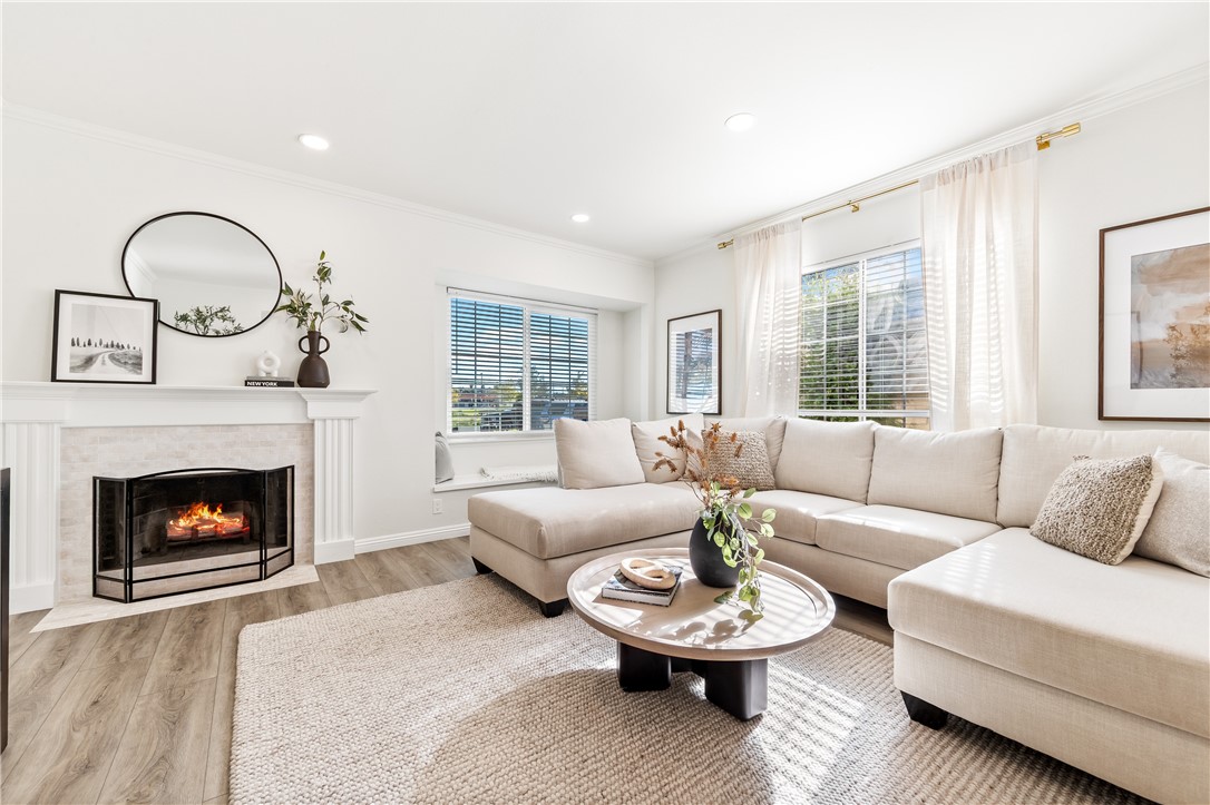 423 18th Street Huntington Beach, CA 92648 - Photo 6 of 67 a living room with furniture and a fireplace