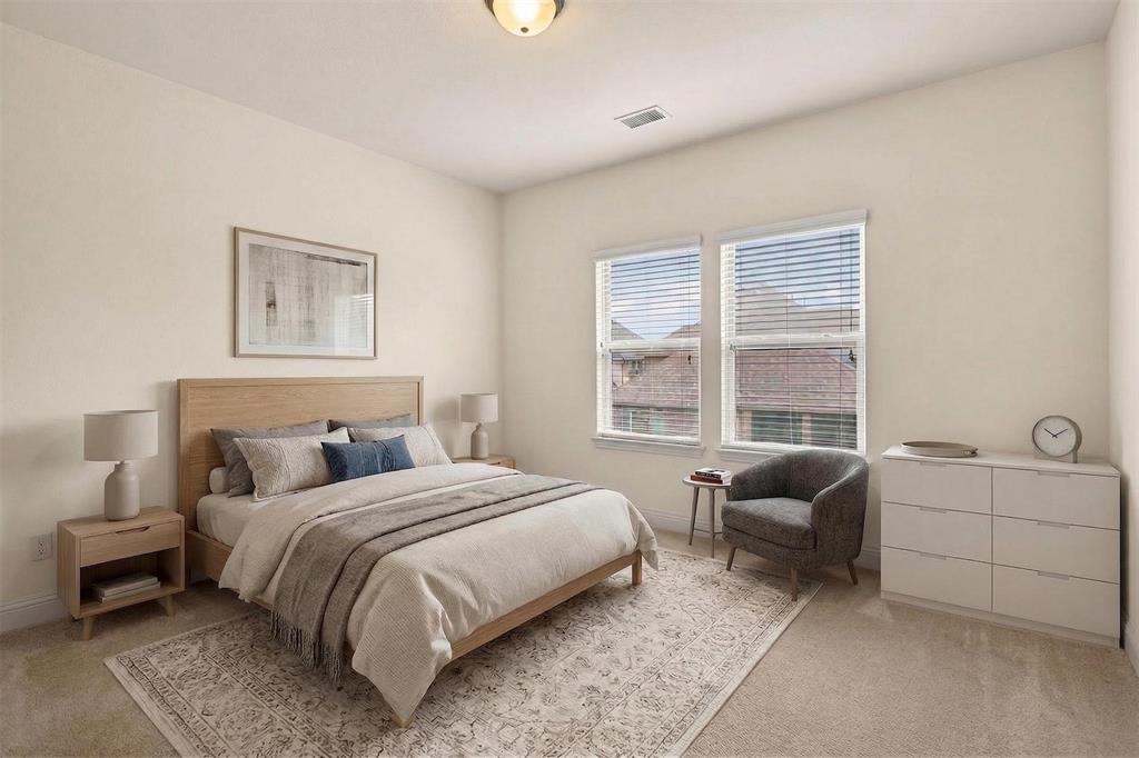 1022 Longhill Way Forney, TX 75126 - Photo 15 of 29 a bedroom with a bed and a couch