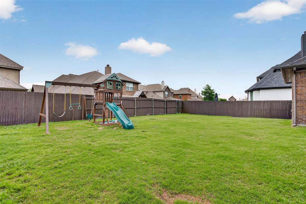 1022 Longhill Way Forney, TX 75126 - Photo 20 of 29 a view of a house with a backyard
