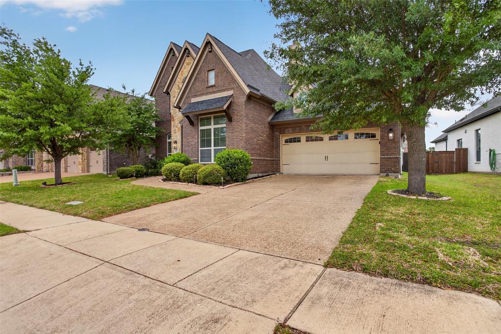 1022 Longhill Way Forney, TX 75126 - Photo 23 of 29 a front view of a house with garden