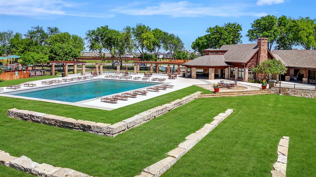 1022 Longhill Way Forney, TX 75126 - Photo 26 of 29 a view of a house with swimming pool and yard