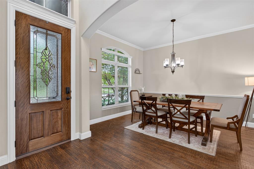 1022 Longhill Way Forney, TX 75126 - Photo 8 of 29 a view of a dining room with furniture window and wooden floor