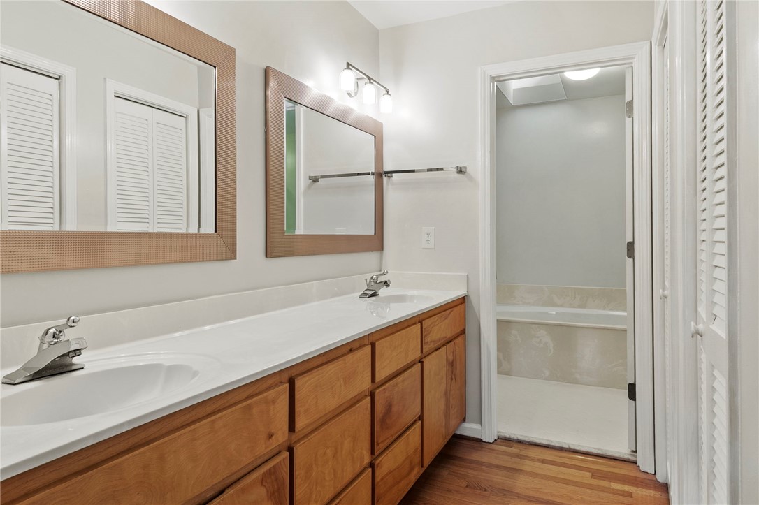 225 Arrowhead Trail Easley, SC 29642 - Photo 13 of 33 This bathroom features a double vanity and sleek fixtures.