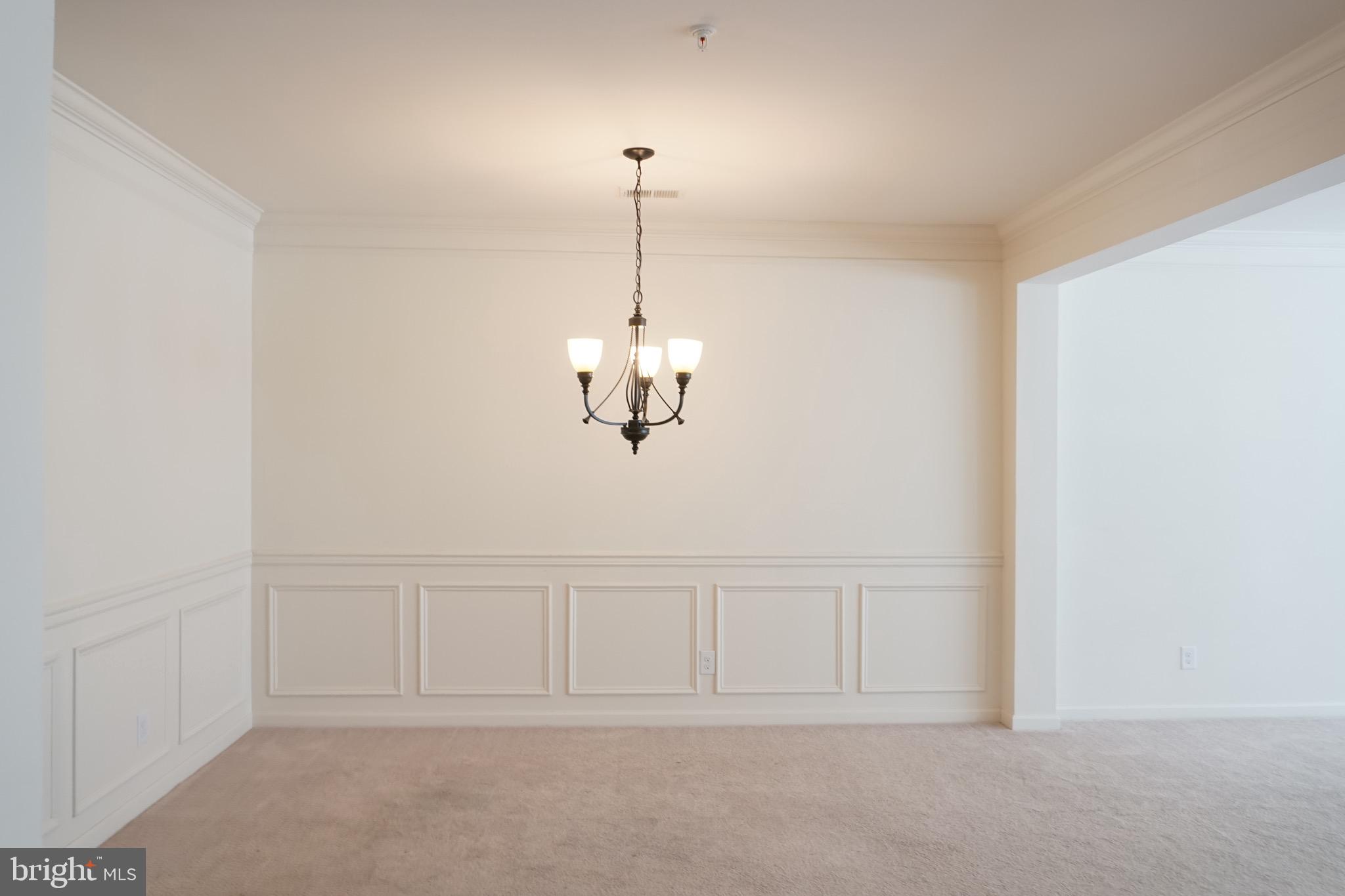2261 Kew Gardens Drive, Unit 186 Woodbridge, VA 22191 - Photo 11 of 32 a view of an empty room with chandelier fan