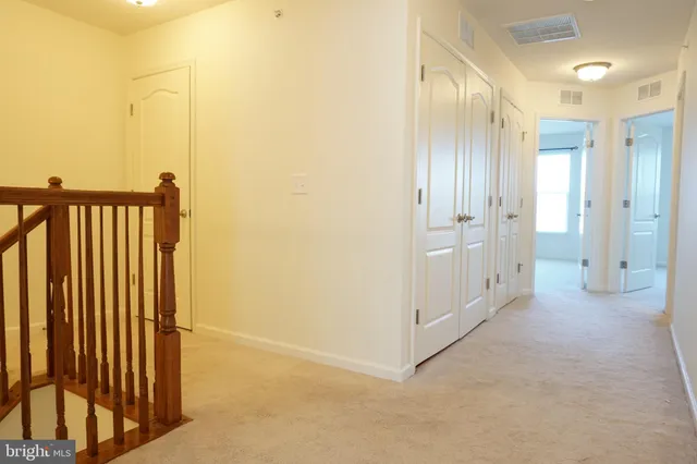 a view of a hallway with closet area