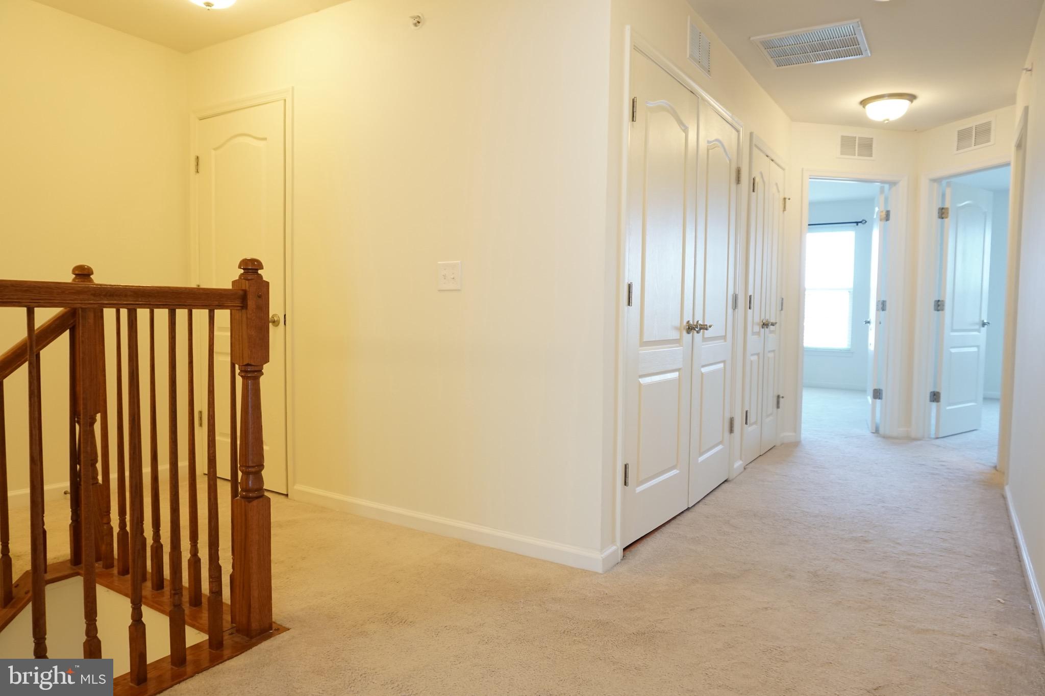 2261 Kew Gardens Drive, Unit 186 Woodbridge, VA 22191 - Photo 13 of 32 a view of a hallway with closet area