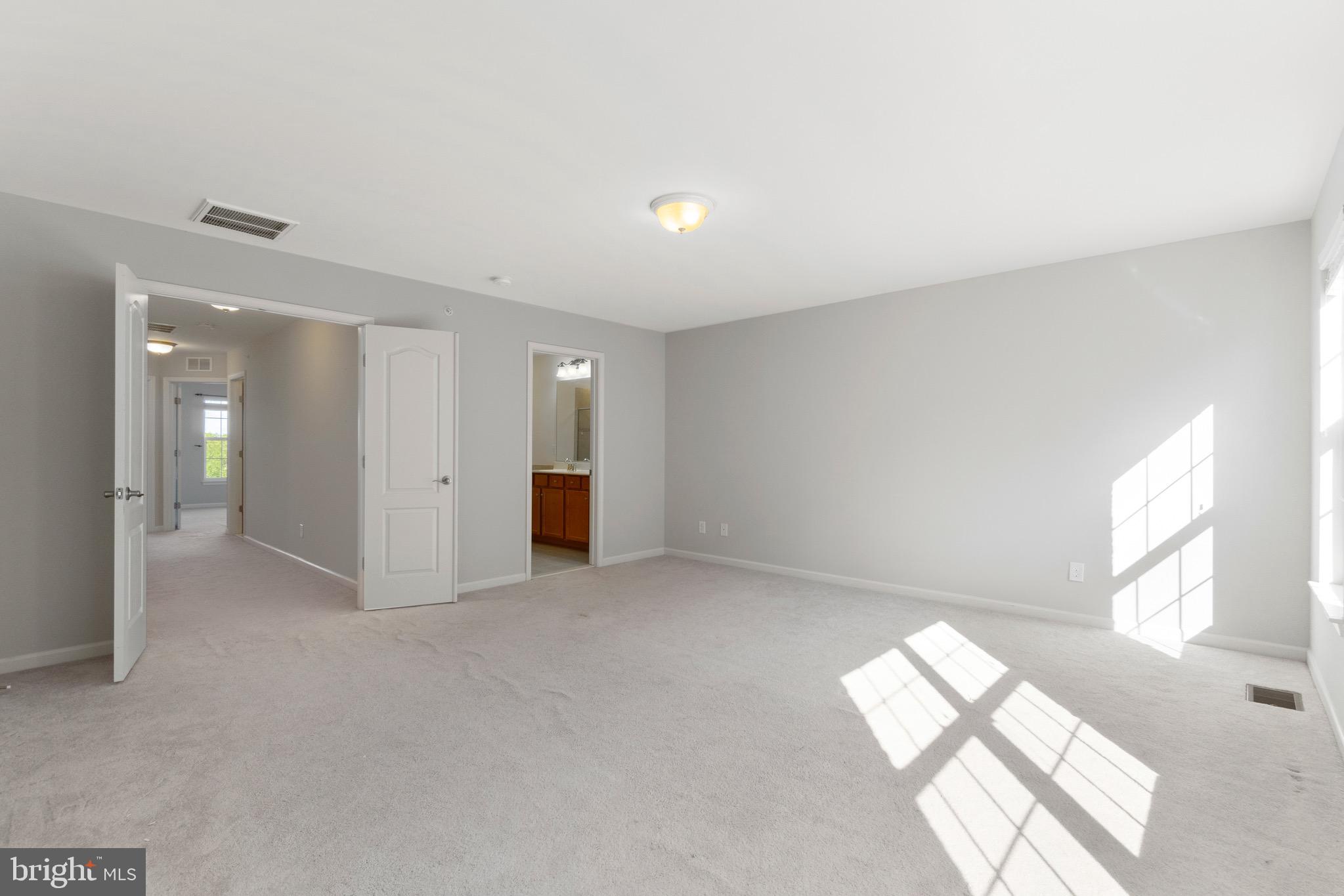 2261 Kew Gardens Drive, Unit 186 Woodbridge, VA 22191 - Photo 15 of 32 an empty room with windows and entrance