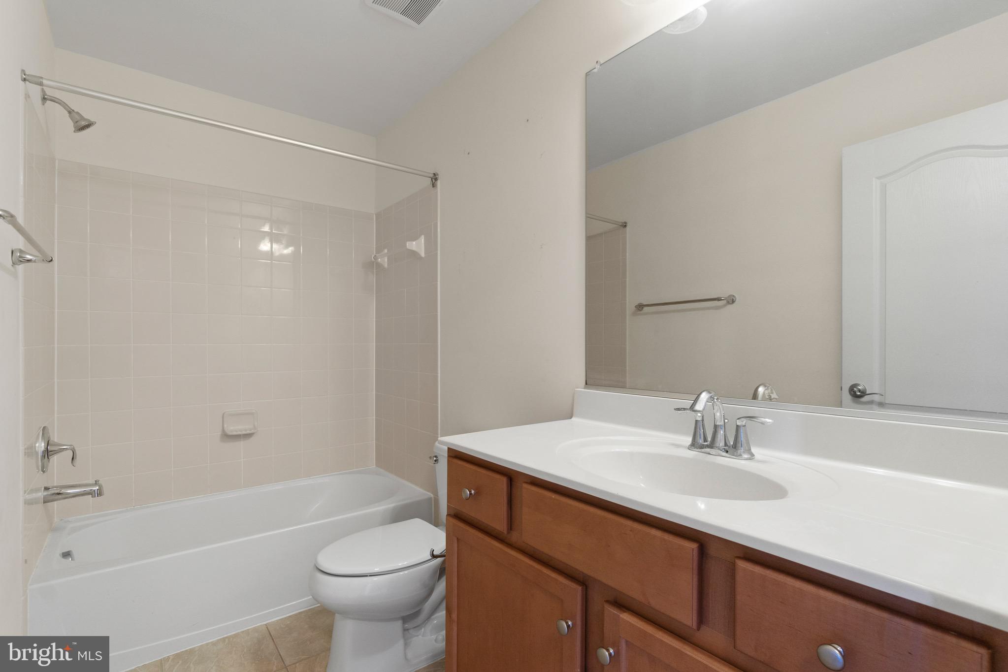 2261 Kew Gardens Drive, Unit 186 Woodbridge, VA 22191 - Photo 25 of 32 a bathroom with a sink a toilet and shower