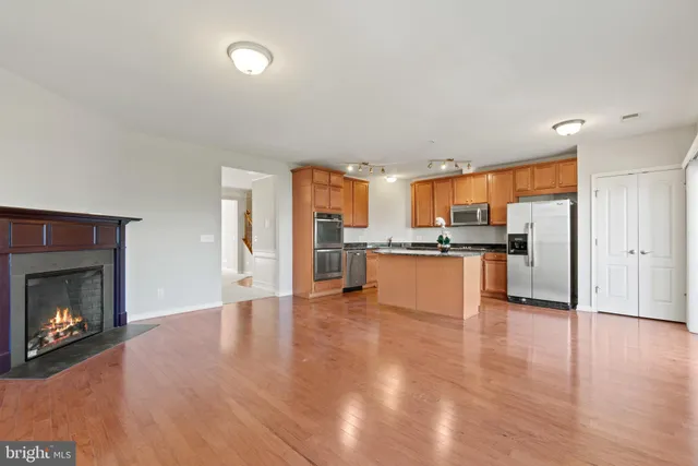a view of kitchen with refrigerator stove microwave and cabinets