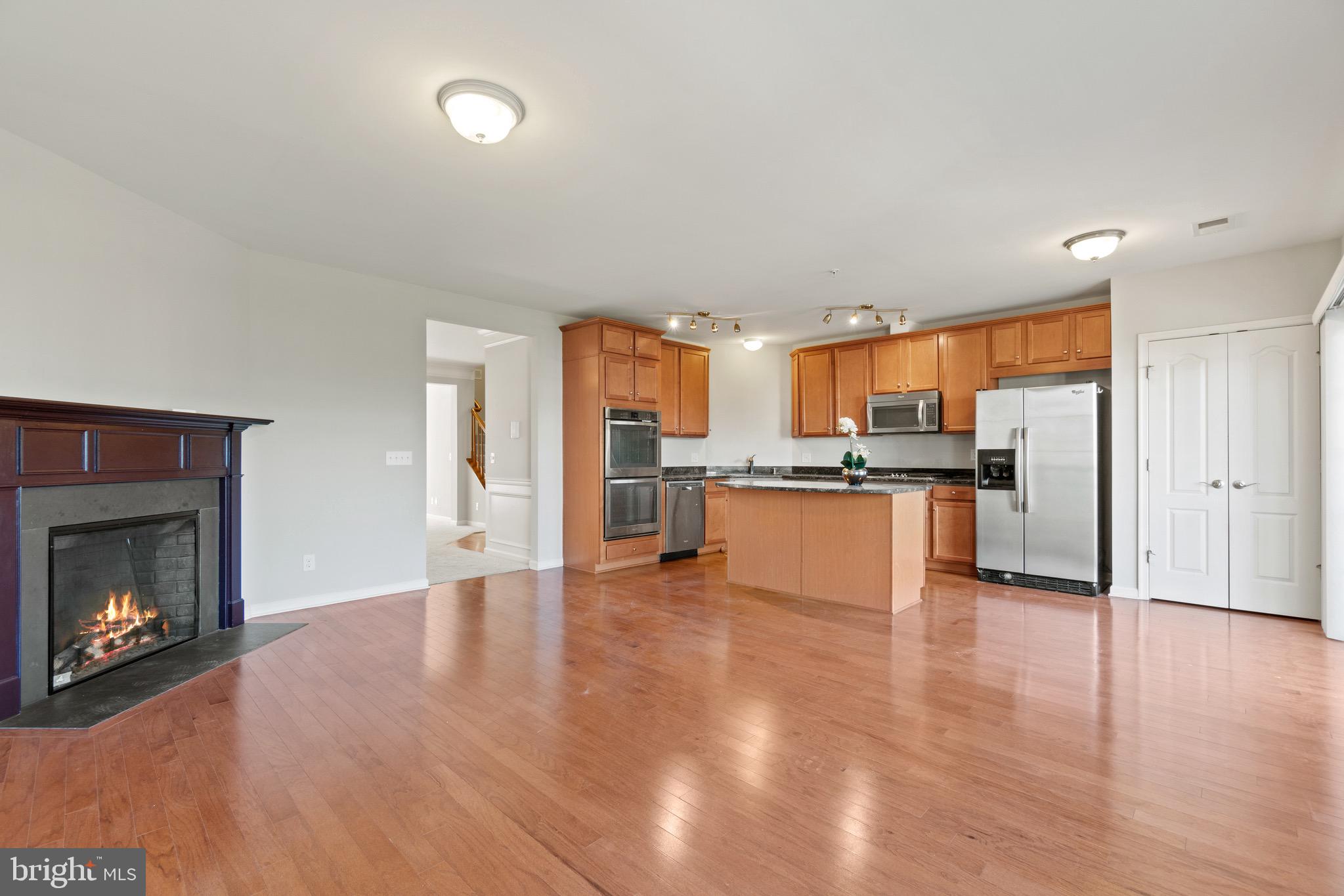 2261 Kew Gardens Drive, Unit 186 Woodbridge, VA 22191 - Photo 5 of 32 a view of kitchen with refrigerator stove microwave and cabinets