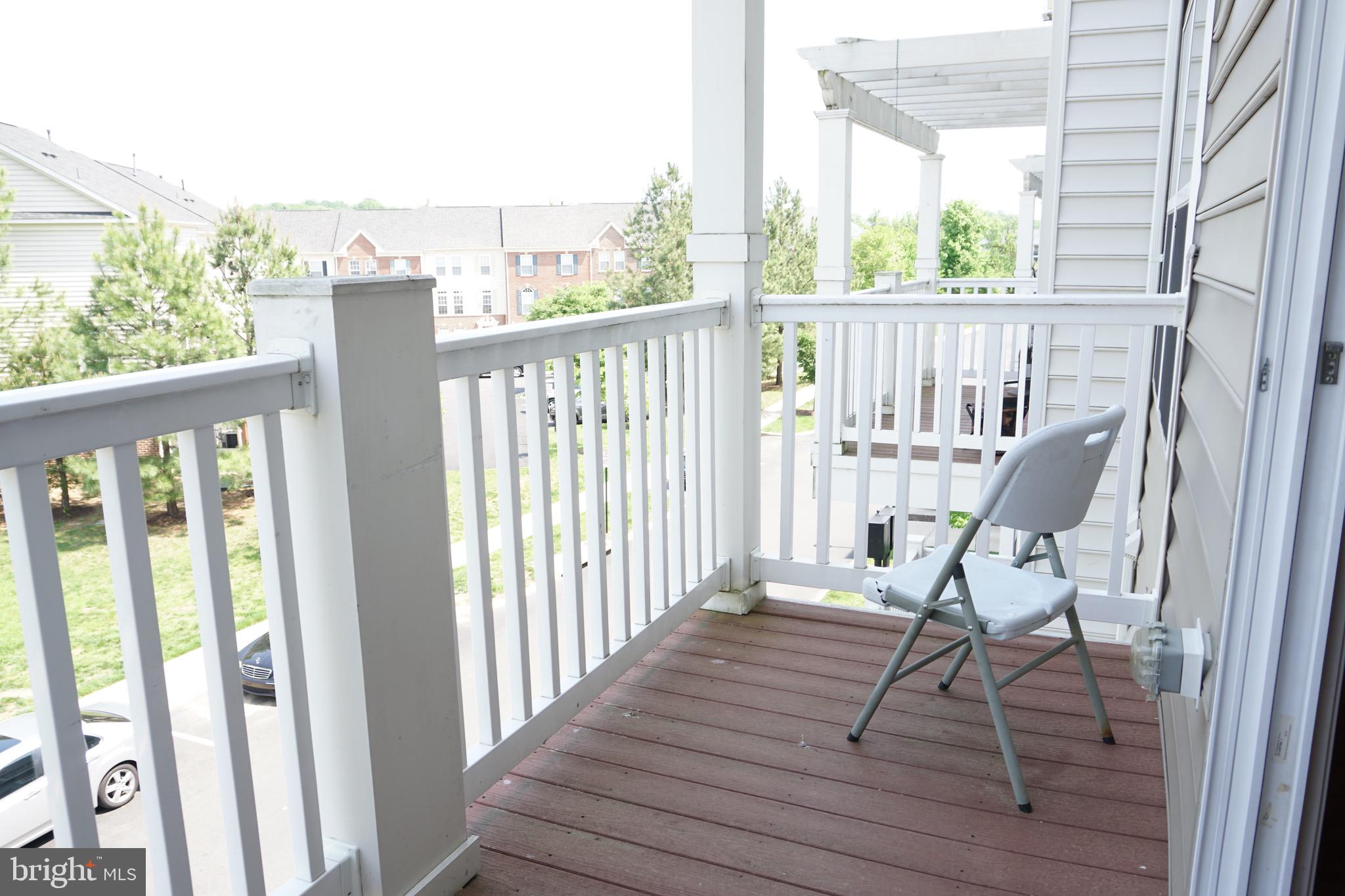 2261 Kew Gardens Drive, Unit 186 Woodbridge, VA 22191 - Photo 7 of 32 a view of balcony with wooden floor and iron fence