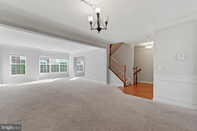 a view of an empty room with stairs