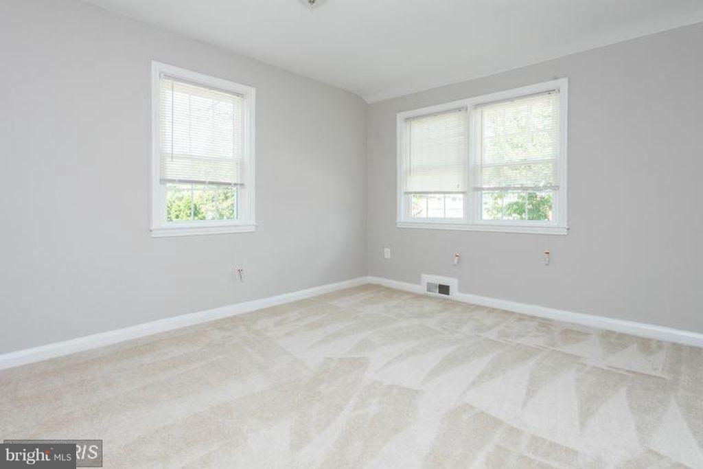 1239 Cedarcroft Road Baltimore, MD 21239 - Photo 11 of 16 an empty room with a window