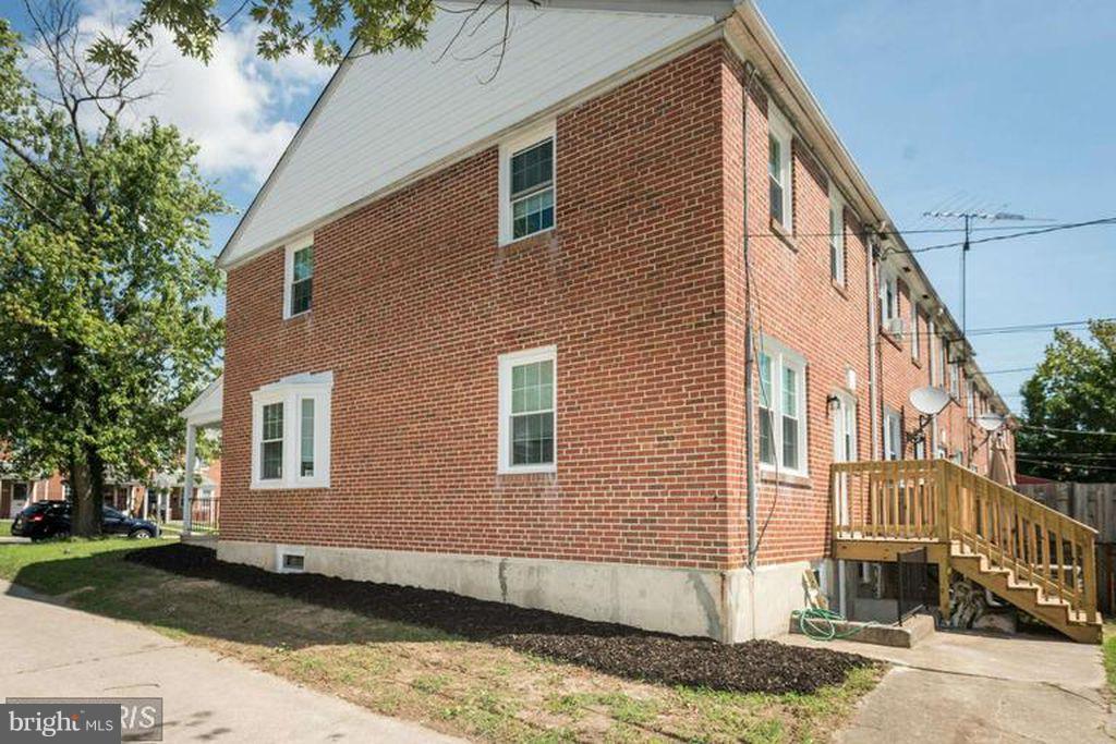 1239 Cedarcroft Road Baltimore, MD 21239 - Photo 15 of 16 a view of a house with a yard