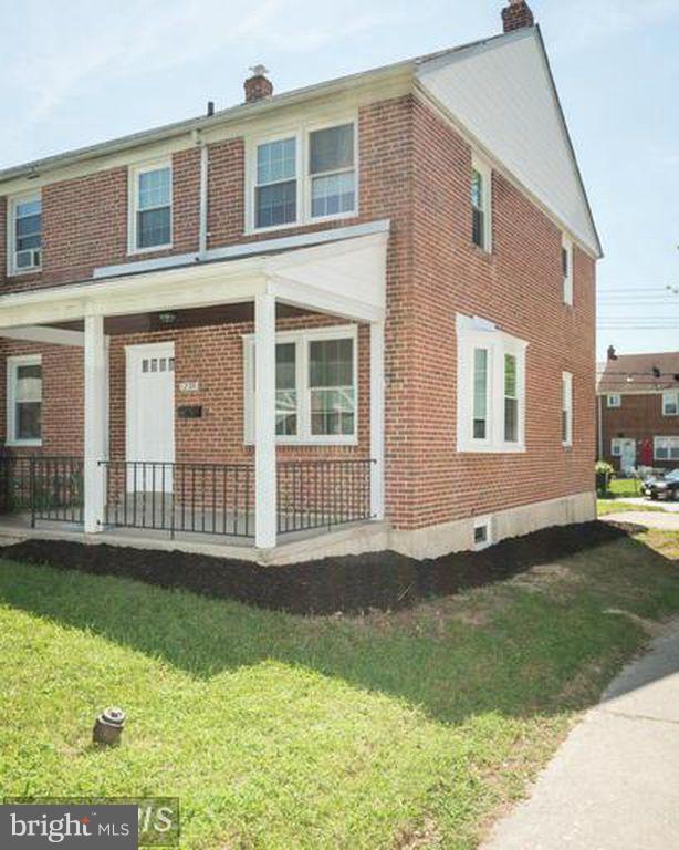 1239 Cedarcroft Road Baltimore, MD 21239 - Photo 16 of 16 a view of a house with a yard and a large window