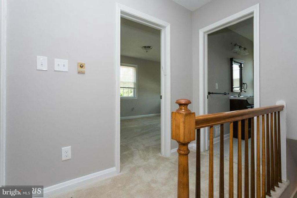 1239 Cedarcroft Road Baltimore, MD 21239 - Photo 9 of 16 a view of a hallway