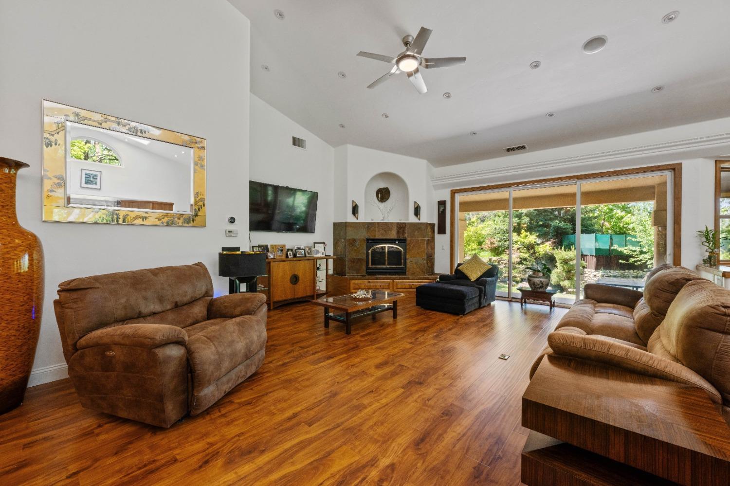 7730 Suzuki Lane Loomis, CA 95650 - Photo 13 of 62 a living room with furniture fireplace and a large window