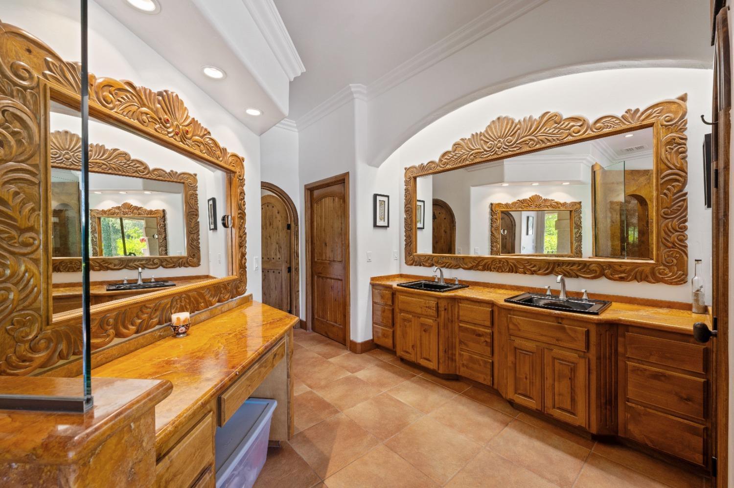 7730 Suzuki Lane Loomis, CA 95650 - Photo 23 of 62 a spacious bathroom with a granite countertop sink mirror and bathtub