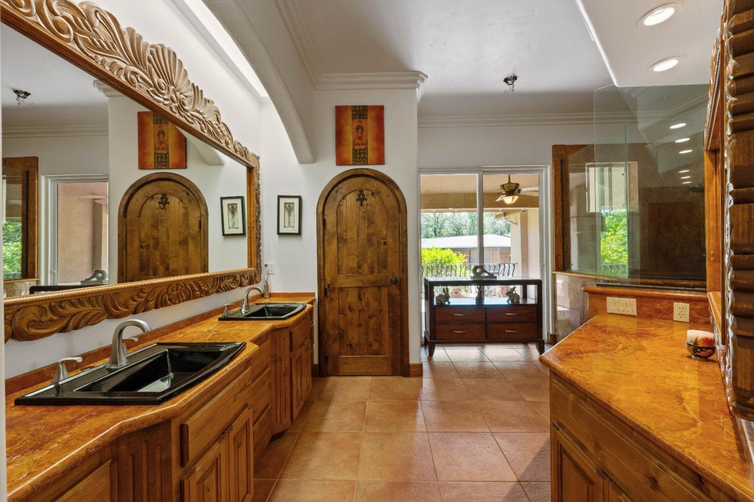 7730 Suzuki Lane Loomis, CA 95650 - Photo 26 of 62 a spacious bathroom with a sink a large mirror and a bathtub