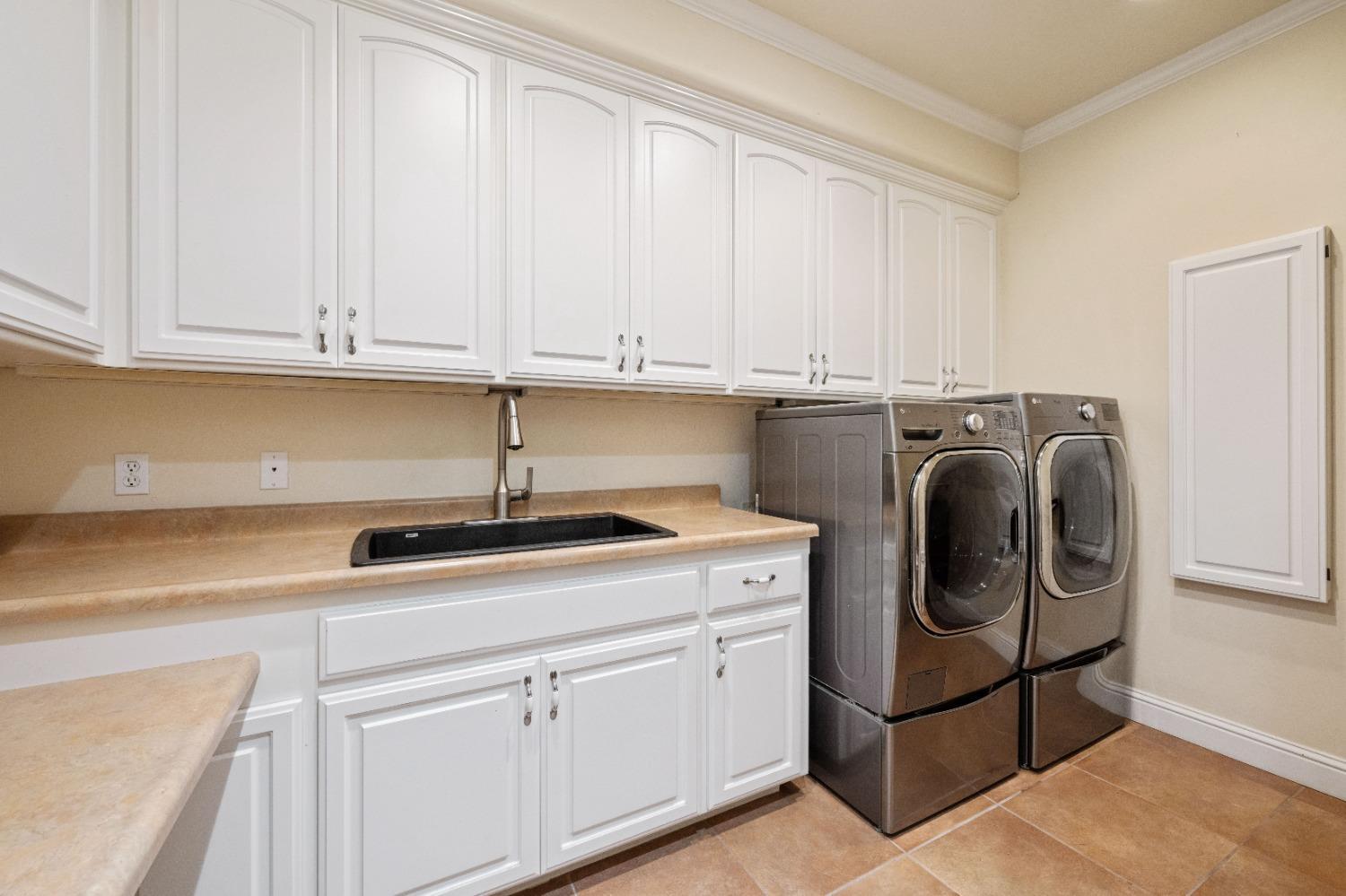 7730 Suzuki Lane Loomis, CA 95650 - Photo 27 of 62 a kitchen with a sink and cabinets
