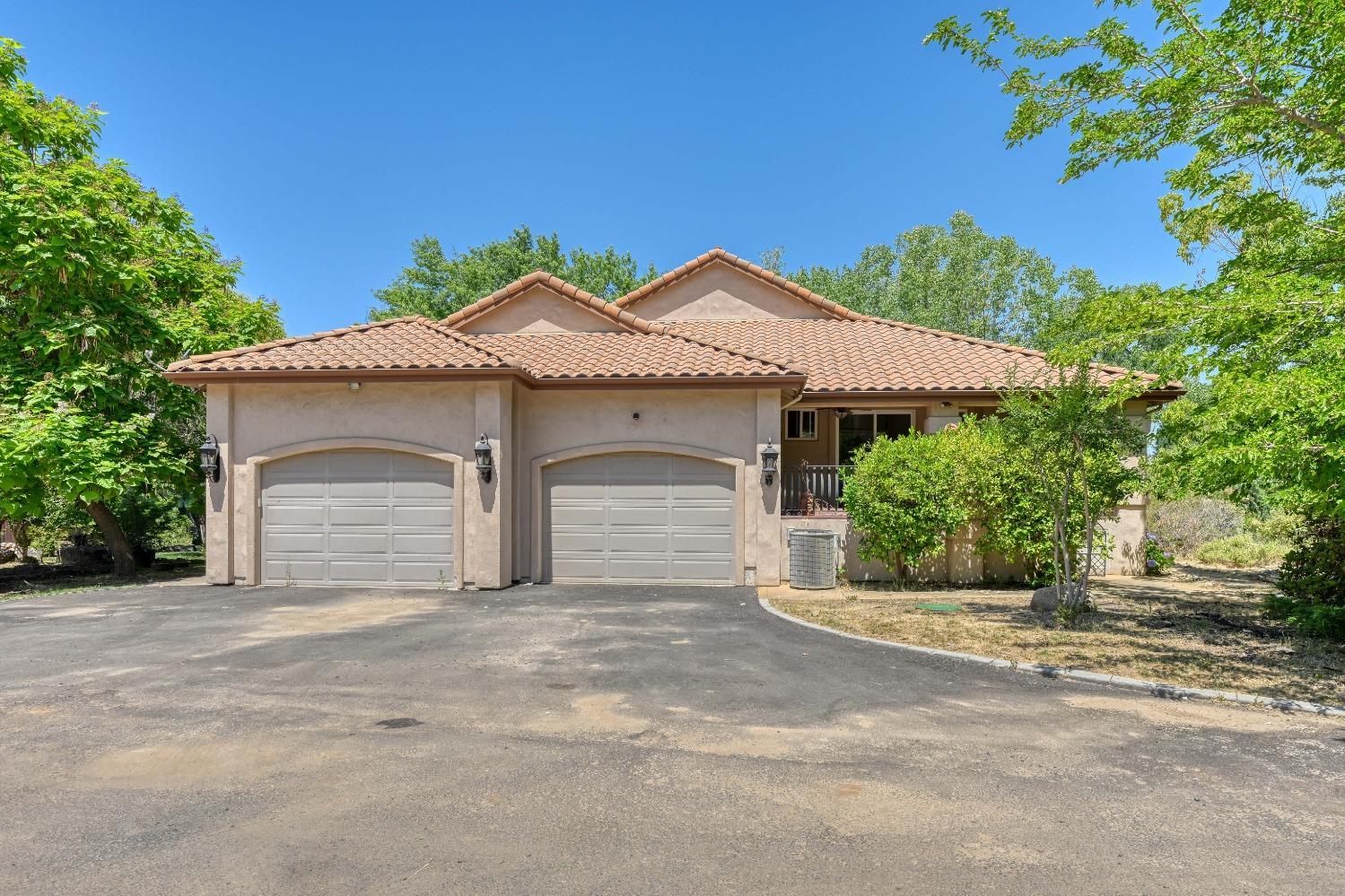 7730 Suzuki Lane Loomis, CA 95650 - Photo 28 of 62 a front view of a house with a garden