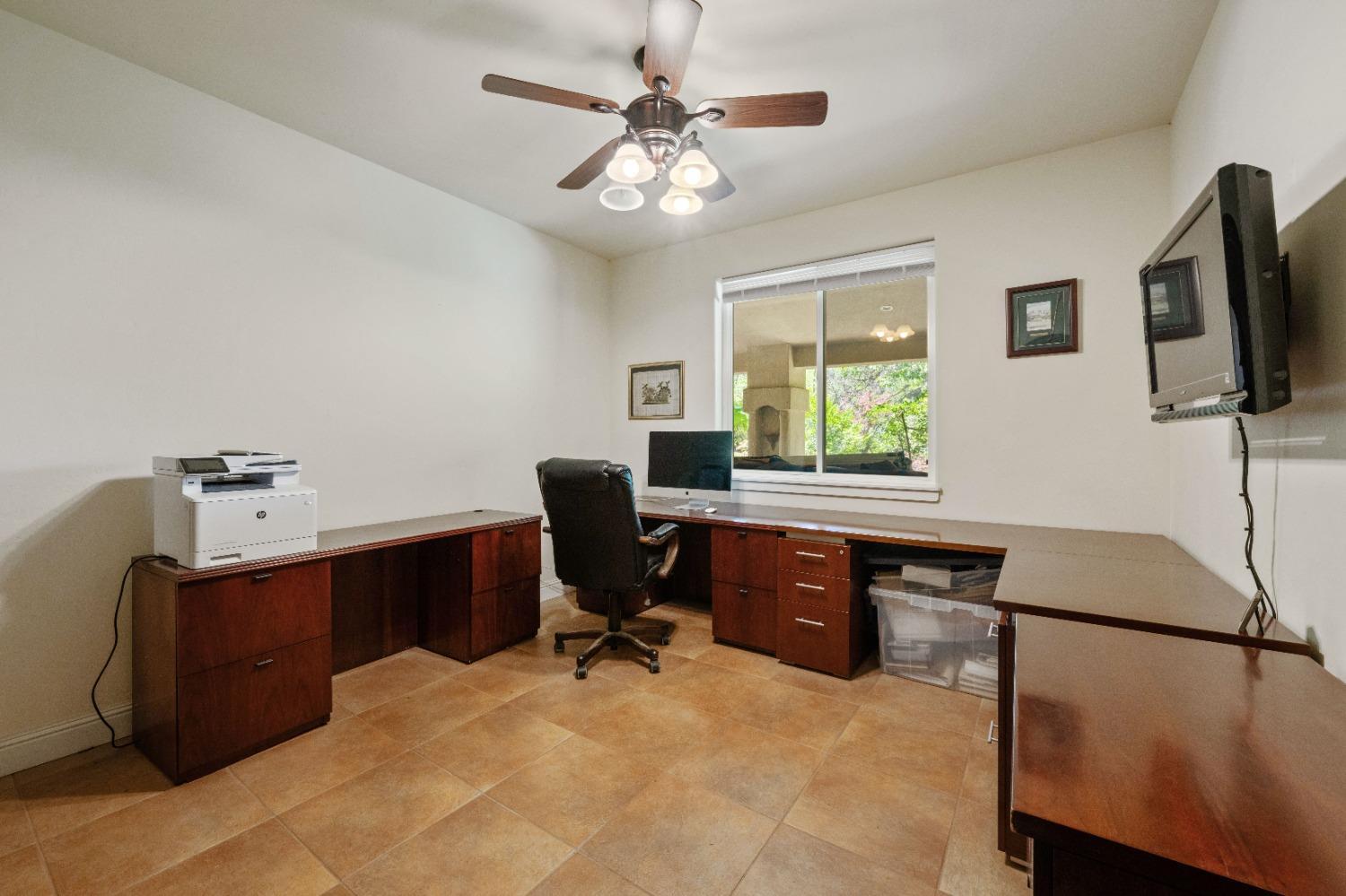 7730 Suzuki Lane Loomis, CA 95650 - Photo 30 of 62 a view of a workspace with furniture and a window