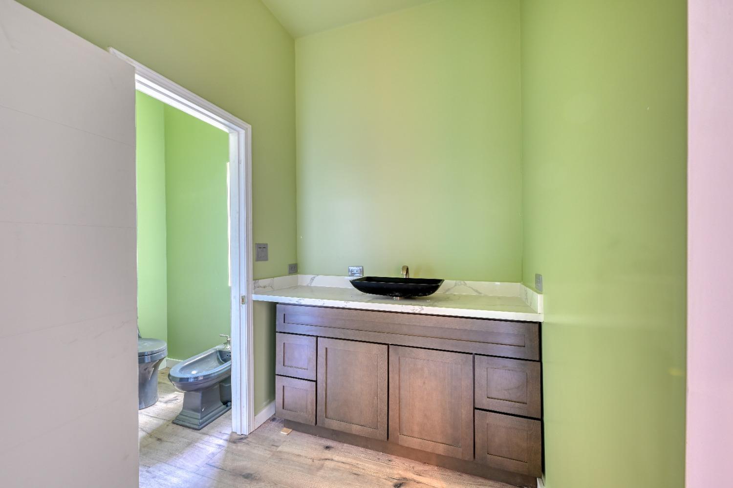 7730 Suzuki Lane Loomis, CA 95650 - Photo 46 of 62 a room with a sink and a toilet