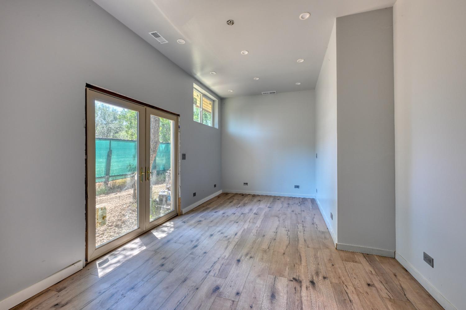 7730 Suzuki Lane Loomis, CA 95650 - Photo 50 of 62 wooden floor in an empty room with a window