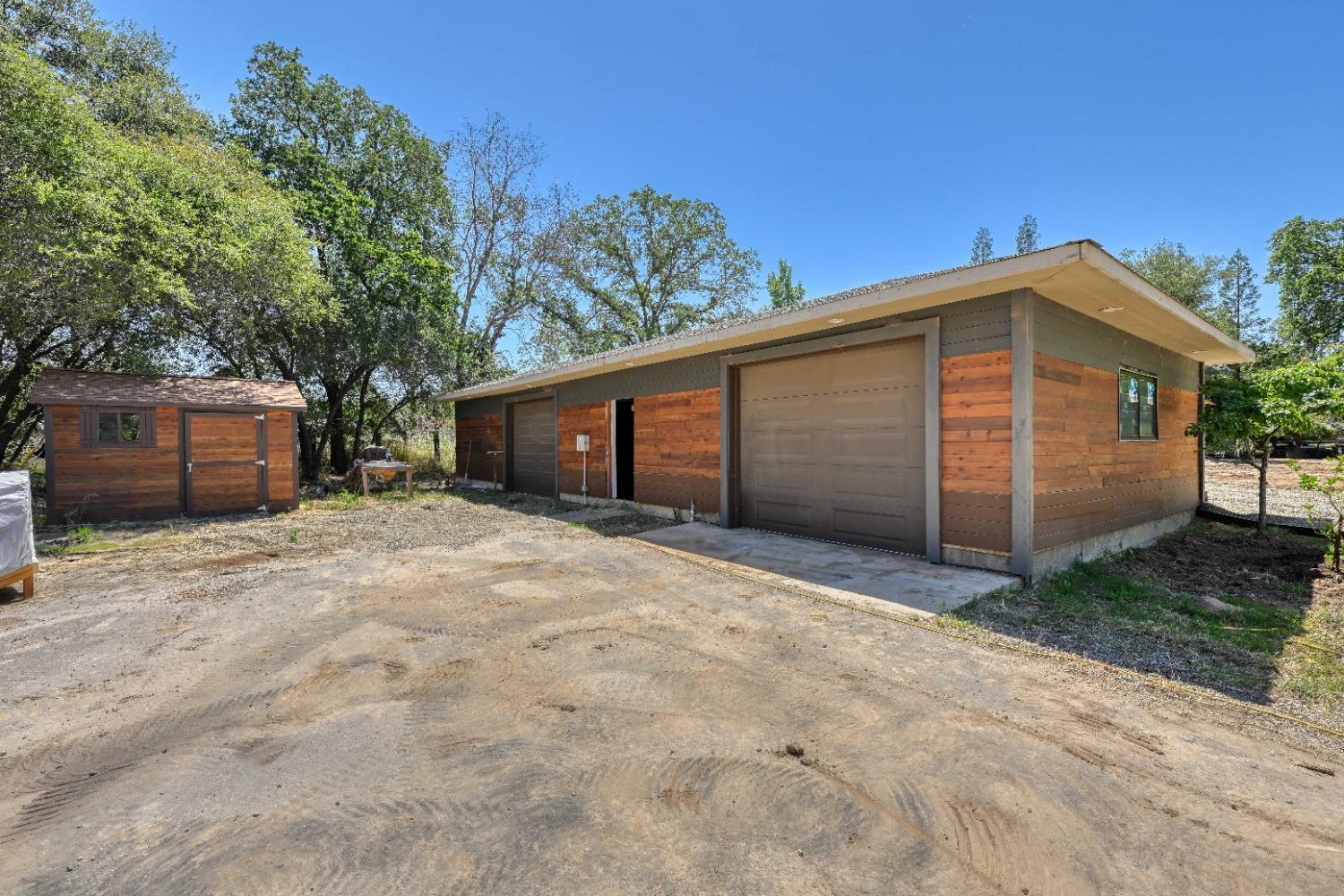 7730 Suzuki Lane Loomis, CA 95650 - Photo 51 of 62 a front view of a house with a yard and garage