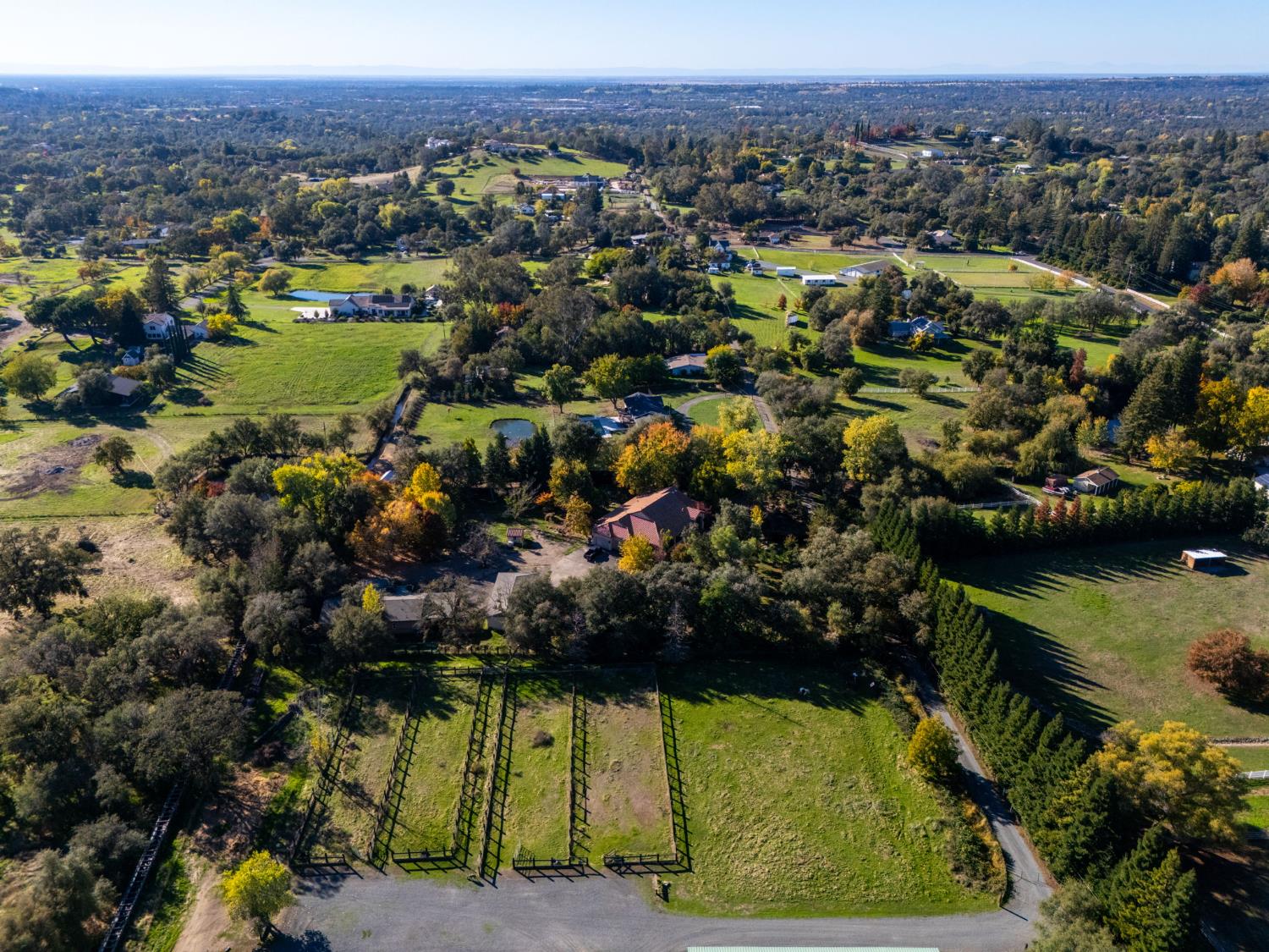 7730 Suzuki Lane Loomis, CA 95650 - Photo 58 of 62 an aerial view of residential houses with outdoor space and swimming pool