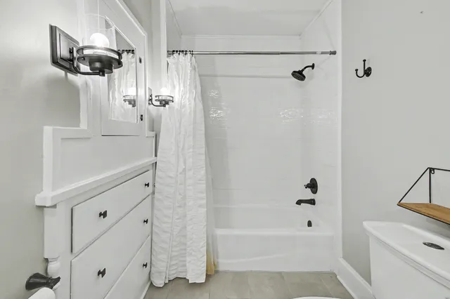a bathroom with a shower and a tub