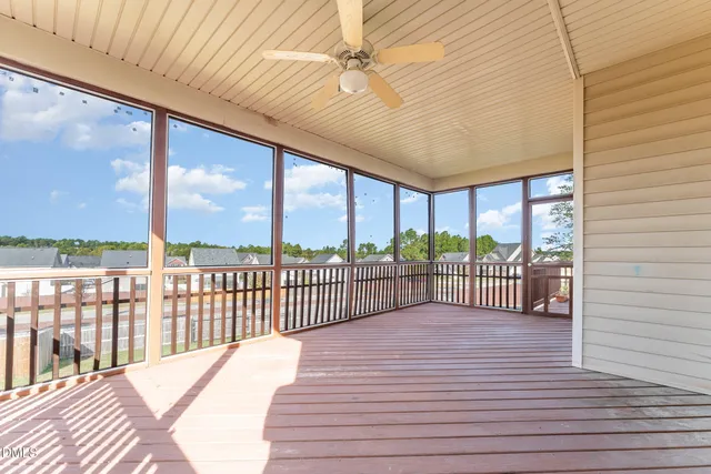 a view of a balcony with wooden floor
