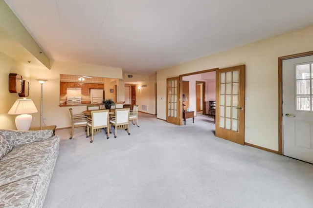 a living room with furniture and a table
