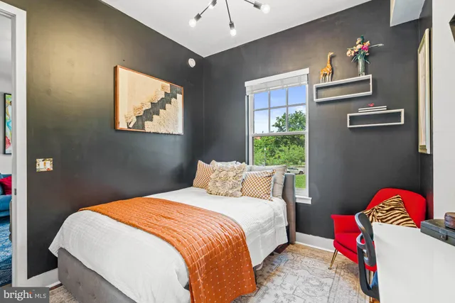 a bathroom with a sink a toilet a shower curtain and a bath tub