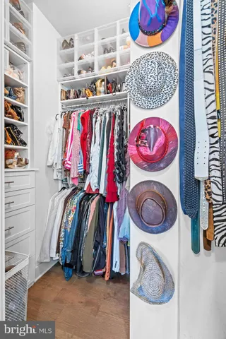 a living room with furniture dining table and wooden floor