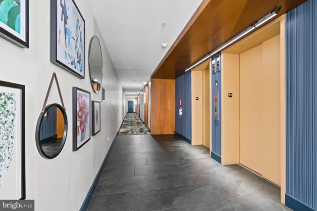 a kitchen with stainless steel appliances kitchen island granite countertop a table and chairs in it