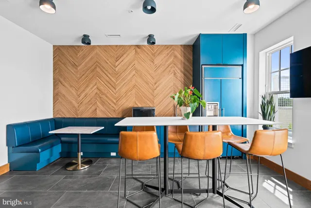 a view of building with swimming pool outdoor seating