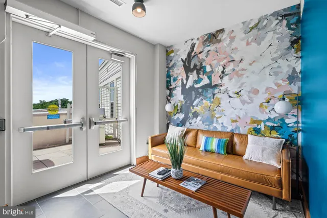 a dinning table and chairs in patio of a house