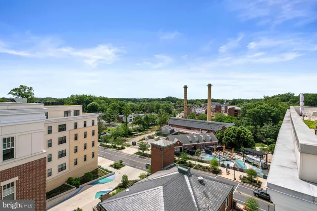 a view of a wooden house with a small yard