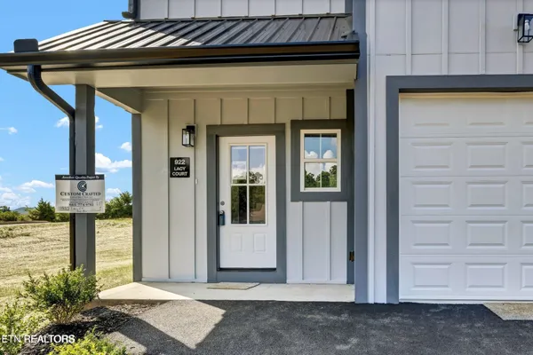 a front view of a house with a glass door