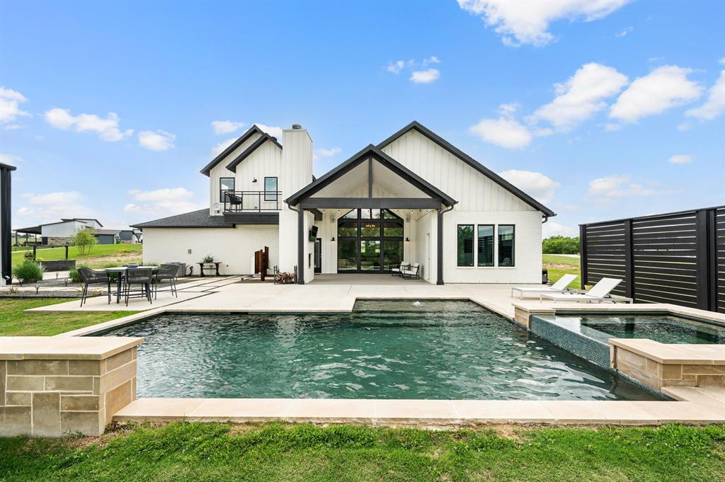 130 Nicholas Way Decatur, TX 76234 - Photo 1 of 1 Welcome home! You'll never want to leave this resort-style pool with its HUGE hot tub and its custom water features!
