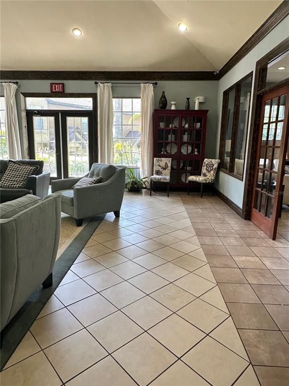 6304 Raleigh Street, Unit 202 Orlando, FL 32835 - Photo 12 of 15 a living room with furniture and large window