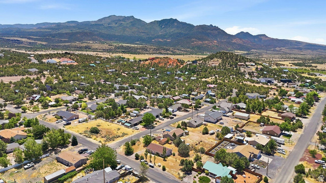 132 Rex Layne Drive Central, UT 84722 - Photo 20 of 39 Expansive residential area featuring a diverse collection of homes, mature trees, and a mountain backdrop
