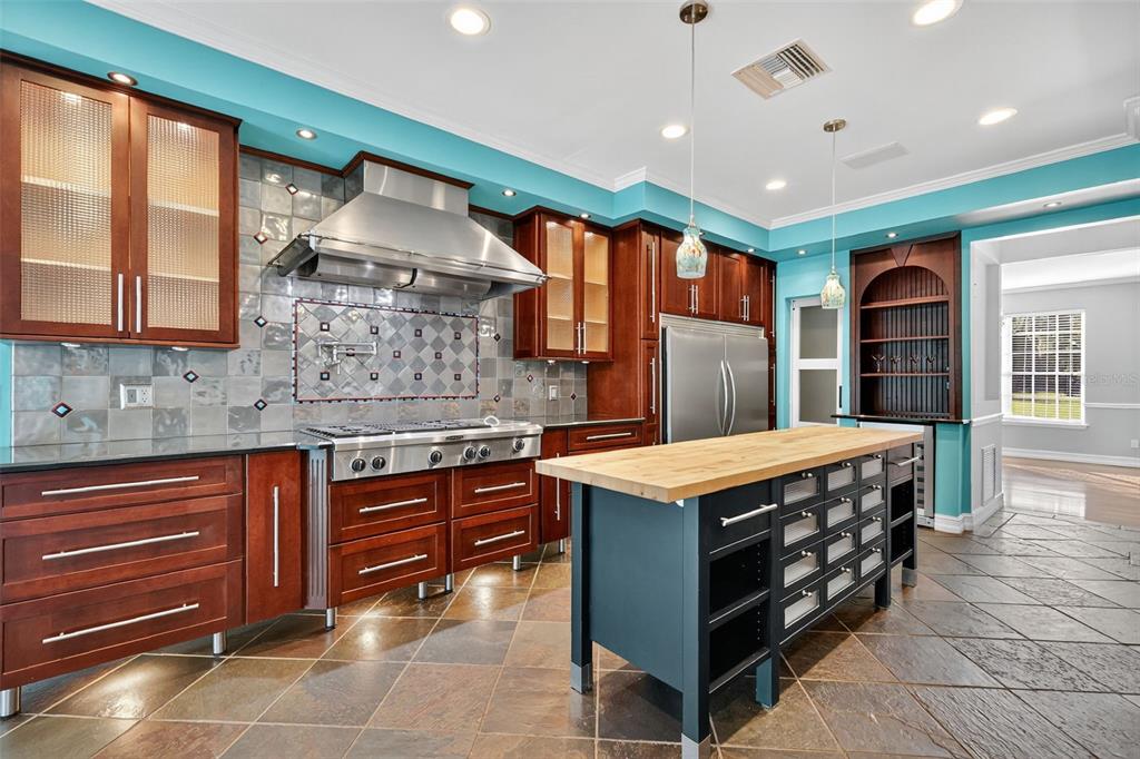 28004 Shirley Shores Road Tavares, FL 32778 - Photo 16 of 68 a kitchen with stainless steel appliances granite countertop a stove and a sink
