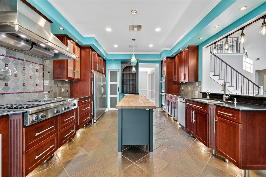 28004 Shirley Shores Road Tavares, FL 32778 - Photo 17 of 68 a kitchen with stainless steel appliances granite countertop a stove a sink dishwasher and a refrigerator
