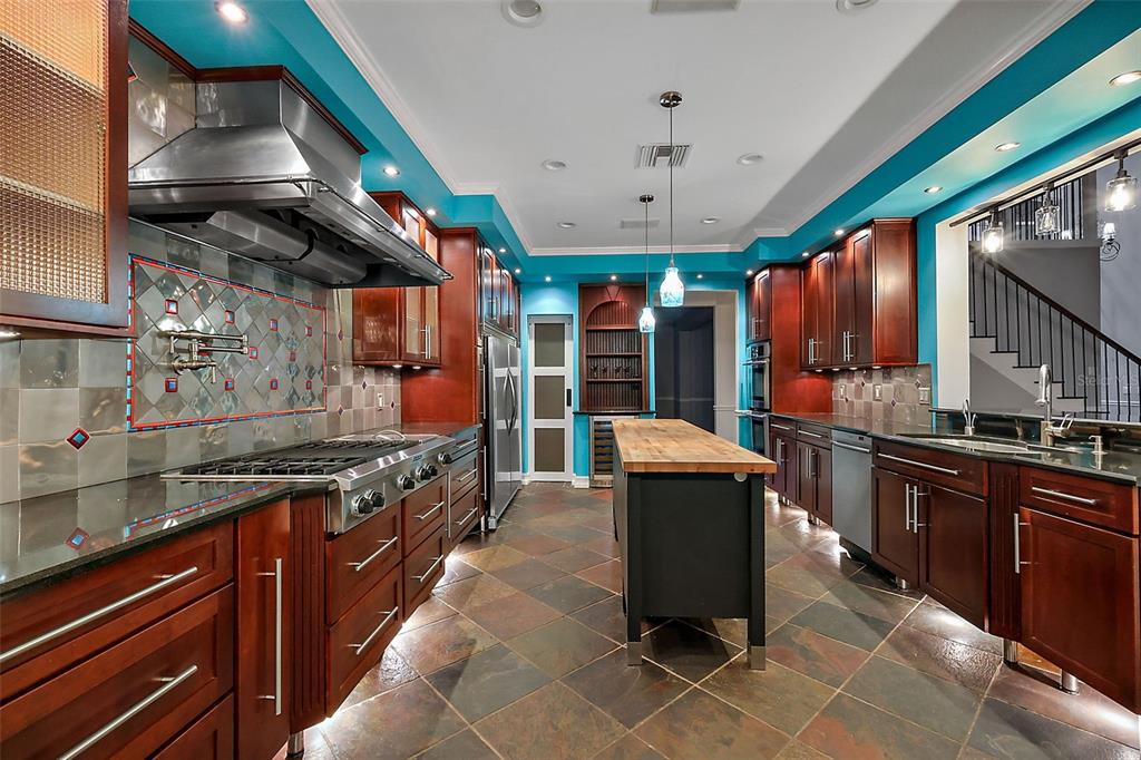 28004 Shirley Shores Road Tavares, FL 32778 - Photo 19 of 68 a kitchen with stainless steel appliances granite countertop a stove a sink and a microwave