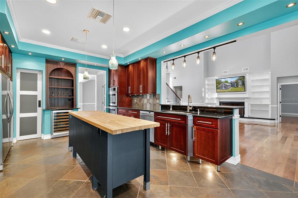 28004 Shirley Shores Road Tavares, FL 32778 - Photo 23 of 68 a kitchen with stainless steel appliances granite countertop a stove a sink and a refrigerator