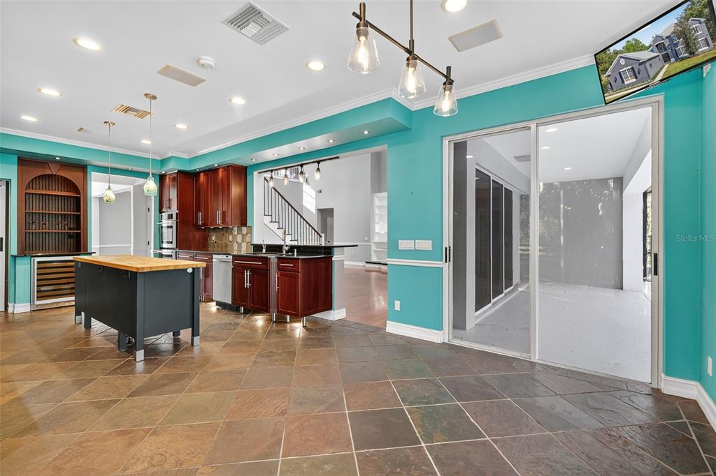 28004 Shirley Shores Road Tavares, FL 32778 - Photo 25 of 68 a open kitchen with a sink cabinets and stainless steel appliances